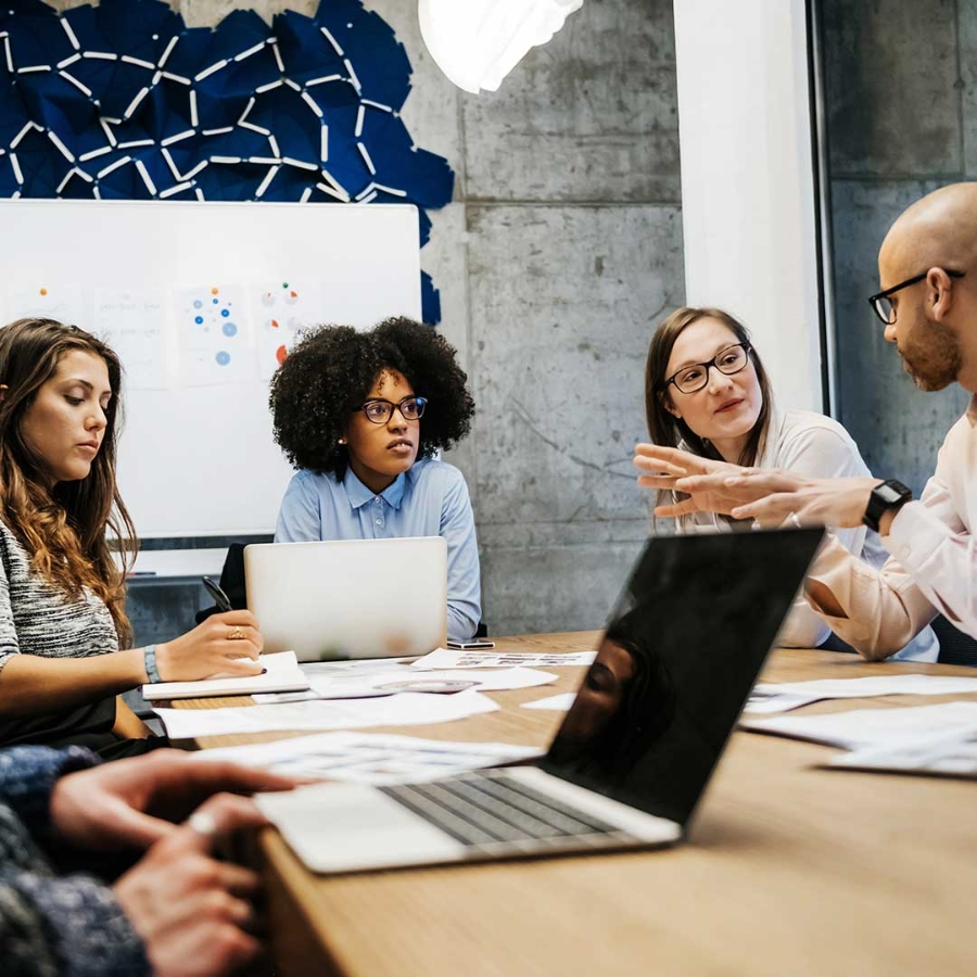Employees discussing in a meeting room